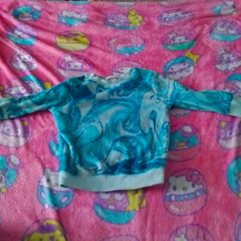 A blue swrild sweater